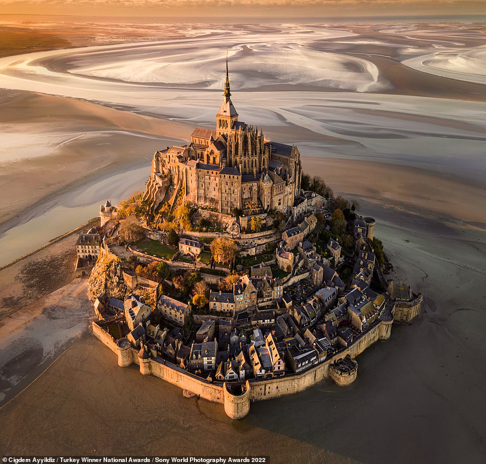 Photographer Cigdem Ayyildiz, who claimed the national award for Turkey, was behind the lens for this enchanting shot, which shows the French commune of Le Mont Saint-Michel at sunset. Ayyildiz says: 'For me, this piece of art on the shores of Normandy is a candidate for Eighth Wonder of the World - providing a legendary view and atmosphere especially at sunset and when the tide is low.'